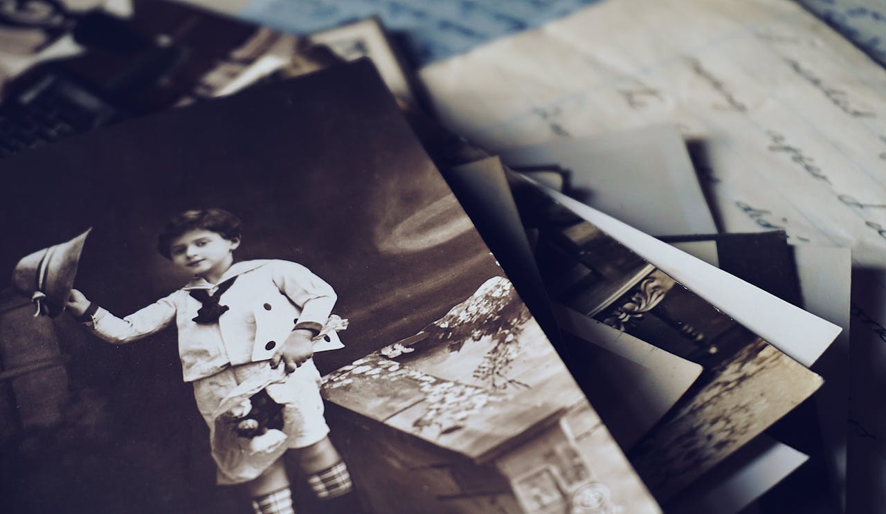 A nostalgic close-up of vintage photos and letters revealing memories from the past.